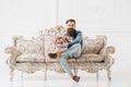 Smiling bearded man with flowers