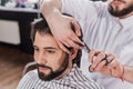 smiling bearded man getting haircut Royalty Free Stock Photo