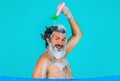 Smiling bearded man pouring shampoo on head. Male haircare. Washing hair. Taking shower. Bath time. Royalty Free Stock Photo