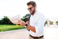 Smiling bearded man in sunglasses and business clothes Royalty Free Stock Photo