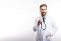 Smiling Bearded MD Posing With Stethoscope to Auscultate Royalty Free Stock Photo