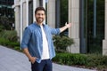 Confident bearded businessman in casual wear standing outside modern office building Royalty Free Stock Photo