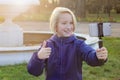 Smiling beatiful preteen girl 9-11 year old taking a selfie outdoors. Child taking a self portrait with mobile phone Royalty Free Stock Photo