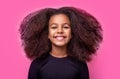 Smiling beautiful african girl with healthy white teeth. Smile little american girl. Girl smile and curly hair. Laughing Royalty Free Stock Photo