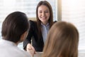 Smiling beautiful businesswoman shaking hands on business meetin