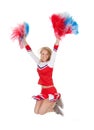 Smiling beautiful cheerleader with pompoms.