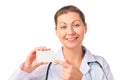 Smiling beautiful doctor showing business card Royalty Free Stock Photo