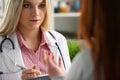 Smiling beautiful female medicine doctor explain Royalty Free Stock Photo