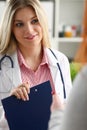 Smiling beautiful female medicine doctor explain Royalty Free Stock Photo