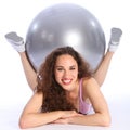 Smiling beautiful fit woman with exercise ball