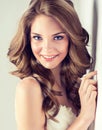 Smiling Beautiful girl, brown hair with an elegant hairstyle , hair waves ,curly. Royalty Free Stock Photo