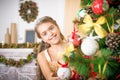 Girl decorates Christmas tree