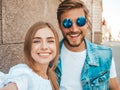 Handsome man and his beautiful girlfriend posing outdoors Royalty Free Stock Photo