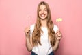 Girl holding life and love lettering on sticks isolated on pink