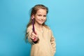 Smiling beautiful girl playing with a stick, close up portrait Royalty Free Stock Photo