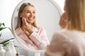 Smiling Beautiful Mature Woman Cleansing Skin With Cotton Pad At Home Royalty Free Stock Photo