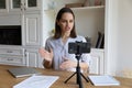 Smiling beautiful millennial woman recording video on mobile selfie camera. Royalty Free Stock Photo