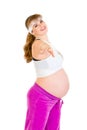 Smiling beautiful pregnant female doing exercise Royalty Free Stock Photo