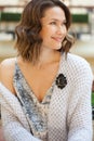 Smiling beautiful woman with a black cameo brooch Royalty Free Stock Photo