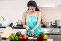 Woman chopping vegetables Royalty Free Stock Photo