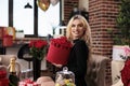 Smiling beautiful woman holding valentines day red roses box Royalty Free Stock Photo