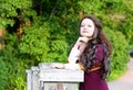 Smiling beautiful woman in medieval suit