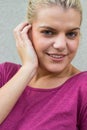 Smiling and beautiful woman over Wall - Building Feature Royalty Free Stock Photo