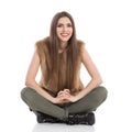 Smiling Beautiful Woman Sitting With Legs Crossed Royalty Free Stock Photo