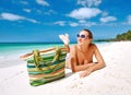 Smiling beautiful woman sunbathing on a beach Royalty Free Stock Photo