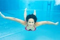 Woman swimming underwater in pool Royalty Free Stock Photo