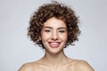 Smiling beautiful young girl with curly hair