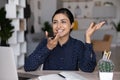 Smiling beautiful young Indian woman dictating audio message. Royalty Free Stock Photo