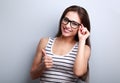 Smiling beautiful young woman in fashion glasses showing thumb u Royalty Free Stock Photo