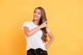 Smiling beautiful young woman pointing to copyspace. Royalty Free Stock Photo