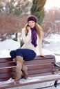 Smiling beautiful young woman relaxing outdoor in a winter day Royalty Free Stock Photo