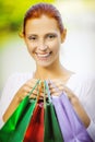 Smiling beautiful young woman with shopping Royalty Free Stock Photo