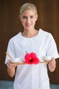 Smiling beauty therapist holding tray of treatments Royalty Free Stock Photo