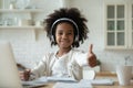 Smiling biracial little girl recommend online course Royalty Free Stock Photo