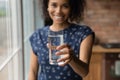 Smiling biracial woman recommend drinking clean water Royalty Free Stock Photo