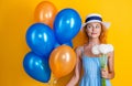 smiling birthday girl with balloons and flowers in studio. birthday girl with balloons and flowers. Royalty Free Stock Photo