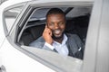 Smiling black businessman having conversation on phone Royalty Free Stock Photo