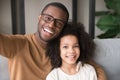 Smiling black father and child taking selfie looking at camera