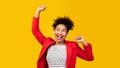 Smiling black girl listening to music and dancing Royalty Free Stock Photo