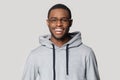 Smiling black male student in stylish hoodie looking at camera. Royalty Free Stock Photo