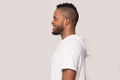 Smiling black man stand in profile isolated in studio Royalty Free Stock Photo