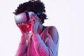 Smiling black teenager exploring virtual reality