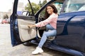 Smiling black woman driving new car in the city Royalty Free Stock Photo