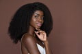 Smiling black young woman isolated on brown background. Beauty, skincare concept Royalty Free Stock Photo