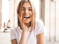 Smiling blond model dressed in summer hipster clothes Royalty Free Stock Photo