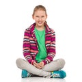 Smiling Blond Teen Girl Sitting Legs Crossed Royalty Free Stock Photo